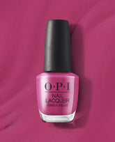 7th & Flower OPI nail polish bottle standing upright, showcasing rich magenta pink nail lacquer with a black cap against a matching glossy pink background, highlighting the vibrant salon-quality nail color for manicures and pedicures.