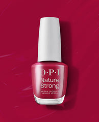 OPI Nature Strong Vegan Nail Lacquer in A Bloom with a View stands upright, showing a rosy berry fall nail color with a white cap against a glossy magenta polish-swatch background.