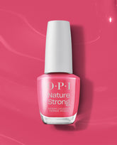 OPI Nature Strong “A Kick in the Bud” vegan nail lacquer bottle displays a bright pink polish, standing upright on a matching glossy backdrop, a fresh pick for spring nail colors and spring nail trends from OPI.