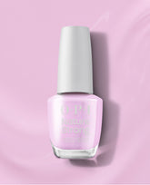 OPI Nature Strong Vegan Nail Lacquer in Natural Mauvement, a soft pale pink shade, standing upright with a white cap on a glossy pink background for subtle fall nail colors.