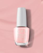 OPI Nature Strong Vegan Nail Lacquer in We Canyon Do Better displayed upright on a soft pink background, showcasing the pale pink natural-origin polish bottle as a premium OPI nail polish gift set option for eco-conscious manicures.
