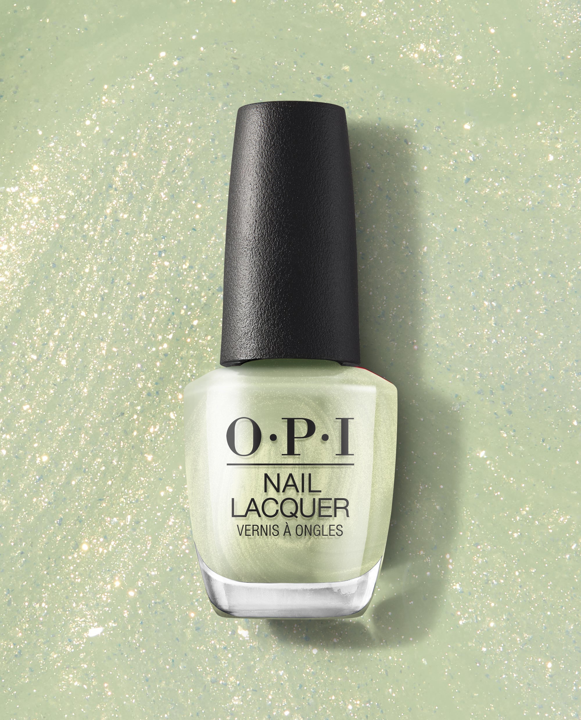 OPI AppointMINT Confirmed Nail Lacquer bottle standing upright, showing a pale mint green polish with fine sparkle on a glittery pastel background—fresh green nail polish perfect for spring nail colors from OPI.
