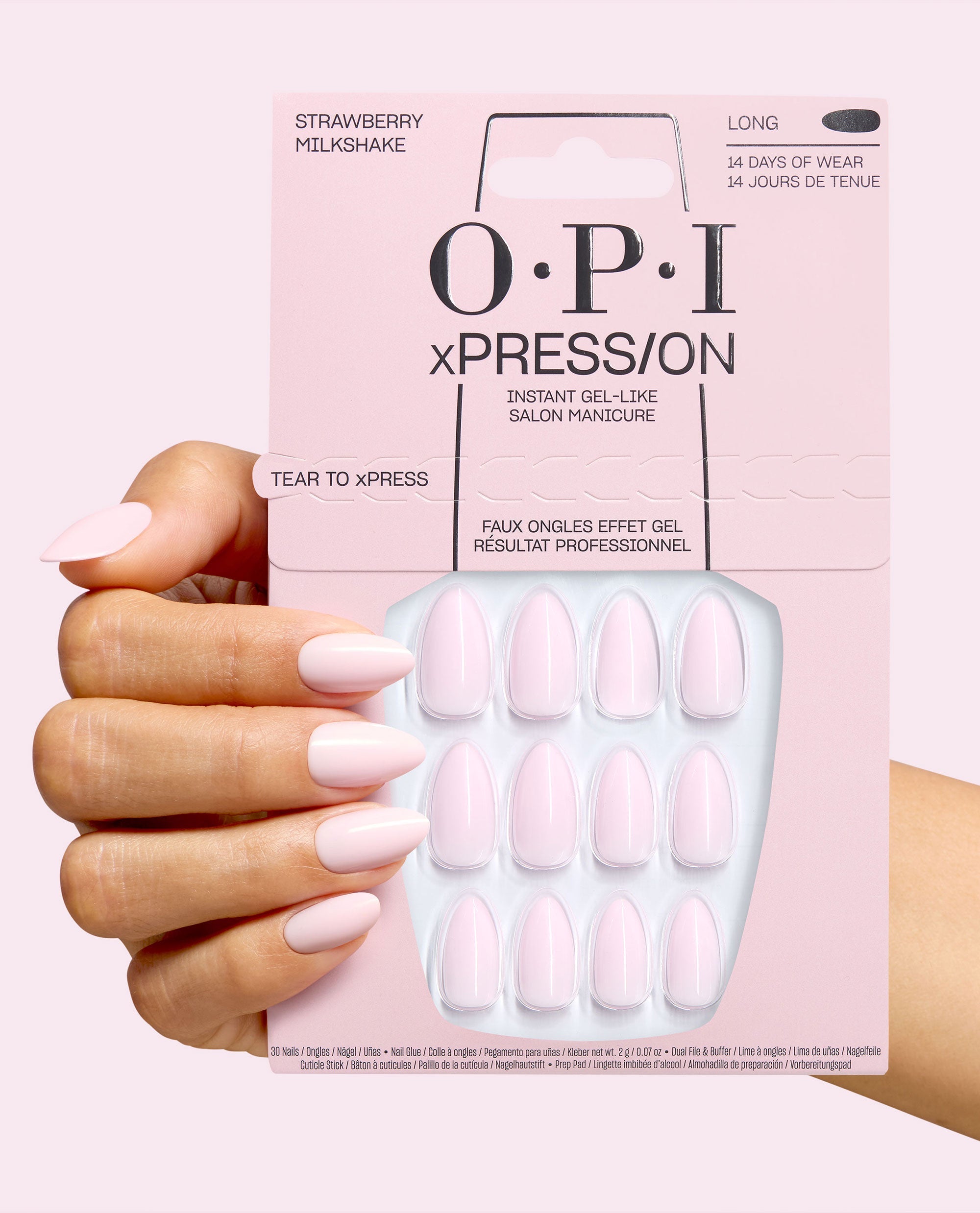 OPI xPRESS/ON Strawberry Milkshake long press-on nails in soft pale pink shown on a manicured hand holding the matching pink instant gel-like salon manicure package.