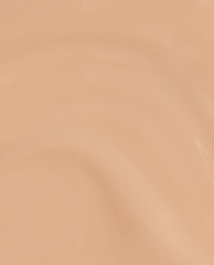 A smooth, glossy swatch of OPI nail polish in A Total Suzi Infinite Shine, showing a warm peachy beige nude shade with subtle light reflections across the creamy lacquer surface.