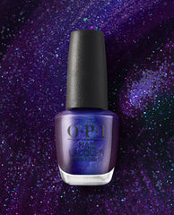 OPI nail polish bottle of Abstract After Dark nail lacquer standing upright, showing deep purple and blue shimmer with fine glitter against a matching sparkling galaxy-style background.