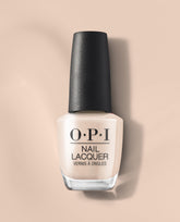 OPI Berlin There, Doin’ That Nail Lacquer bottle showcasing a creamy nude taupe shade with a black textured cap on a soft beige background, a neutral pick for fall nail colors.