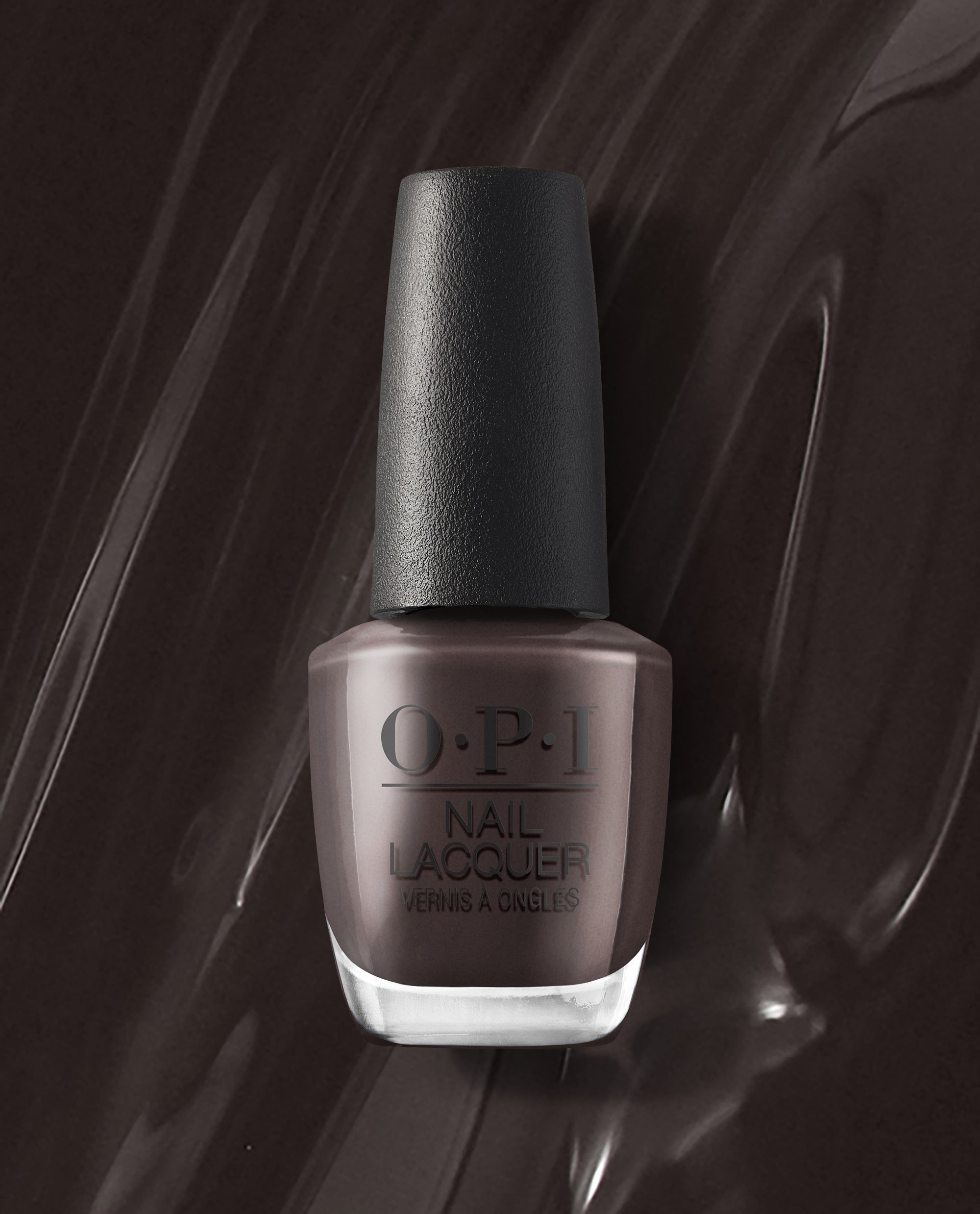 OPI Brown to Earth nail lacquer bottle standing upright, showing a deep earthy brown shade against a glossy dark brown polish smear, ideal for fall nail colors.