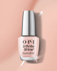 OPI Infinite Shine Bubble Bath® long-lasting pale pink nail polish bottle standing upright against a glossy nude background, ideal as an elegant OPI nail polish gift set for a soft, salon-quality manicure look.