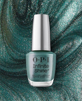 OPI Cos-mo Money Infinite Shine green nail polish bottle standing upright, displaying a shimmery teal, gel-like lacquer finish against a swirling glitter backdrop, highlighting long-wear color perfect for spring nail colors from OPI.
