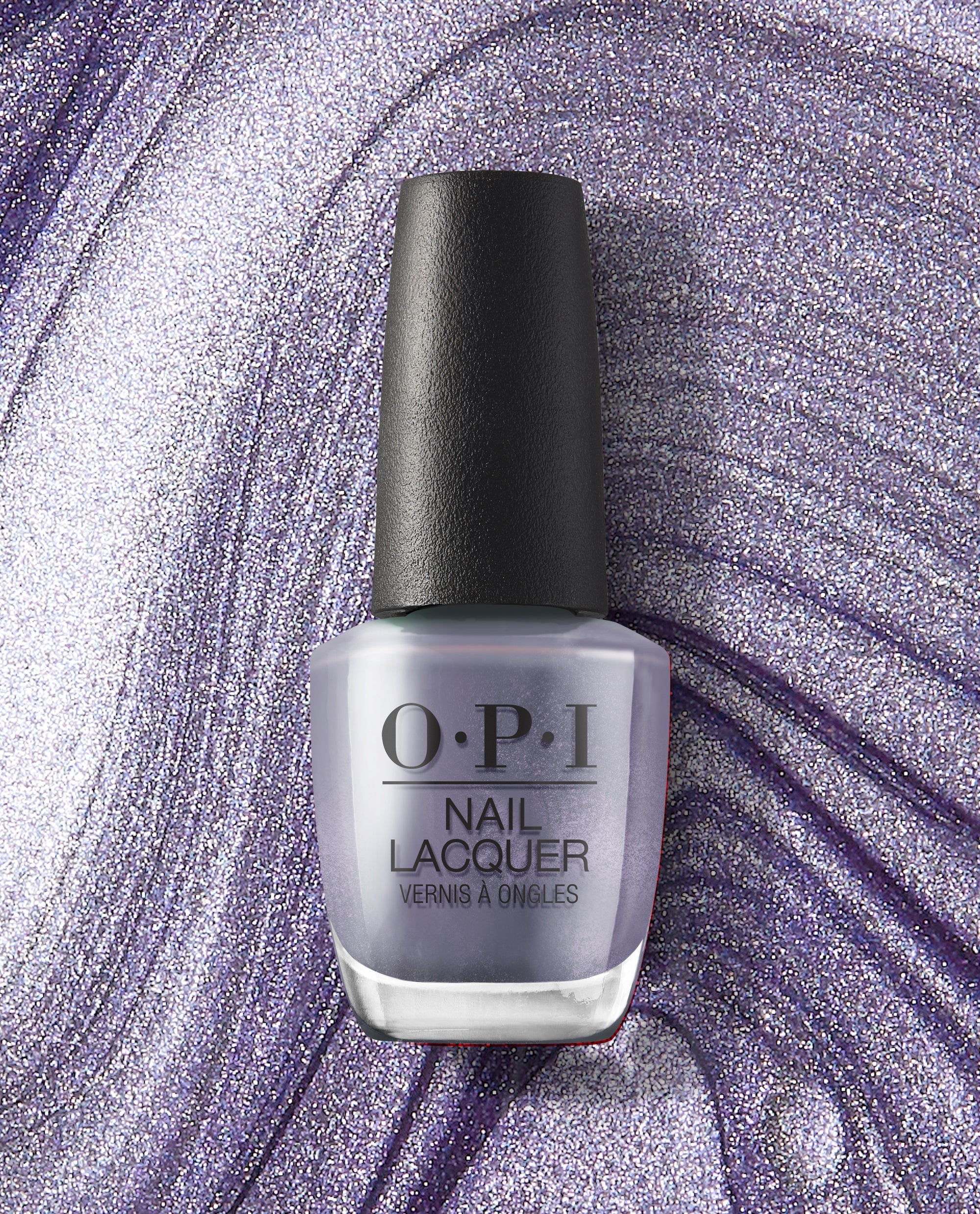 OPI nail polish bottle of You’ve Got Nail nail lacquer standing upright against a swirling metallic lavender and silver glitter background, showcasing the shimmery purple shade and sleek black cap for a modern manicure look.