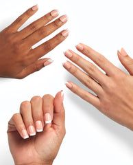 Three manicured hands show the Fluent in French On Point OPI nail polish gift set effect, featuring glossy nude nails with crisp white French tips against a clean white background, highlighting the polished salon-quality finish.