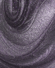 Swirling close-up of Funmetal Infinite Shine OPI nail polish, showing a metallic purple-silver shimmer with fine glitter particles creating a smooth, high-shine, dimensional finish across the lacquer surface.