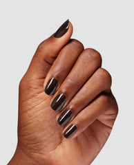 Hand showing short oval nails painted with Grunge Queen OPI nail polish, a deep espresso-brown nail lacquer with subtle shimmer, against a light gray background, highlighting the glossy, salon-quality finish for US manicure shoppers.