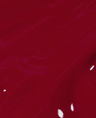Glossy brush swatch of OPI nail polish shade I Love You Just Be-Cusco, showing rich, deep raspberry-red nail lacquer with subtle streaks and highlights against a smooth, fluid background.