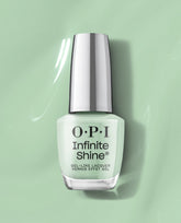OPI Infinite Shine In Mint Condition bottle stands upright, silver cap gleaming, showcasing pastel green nail polish on a glossy mint backdrop—a gel-like finish perfect for spring nail colors and fans of OPI green nail polish.