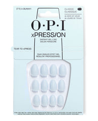 OPI xPRESS/ON It's a Bunny! press-on nails displayed in pale blue packaging, featuring glossy classic short oval nails in a soft white gel-like finish for up to 14 days of wear.