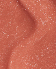 Close-up swatch of OPI nail polish Knee High Stock-blings Infinite Shine, showing a smooth coral-orange base packed with fine silver shimmer, flowing in soft curves to highlight its glossy, long-wear finish.