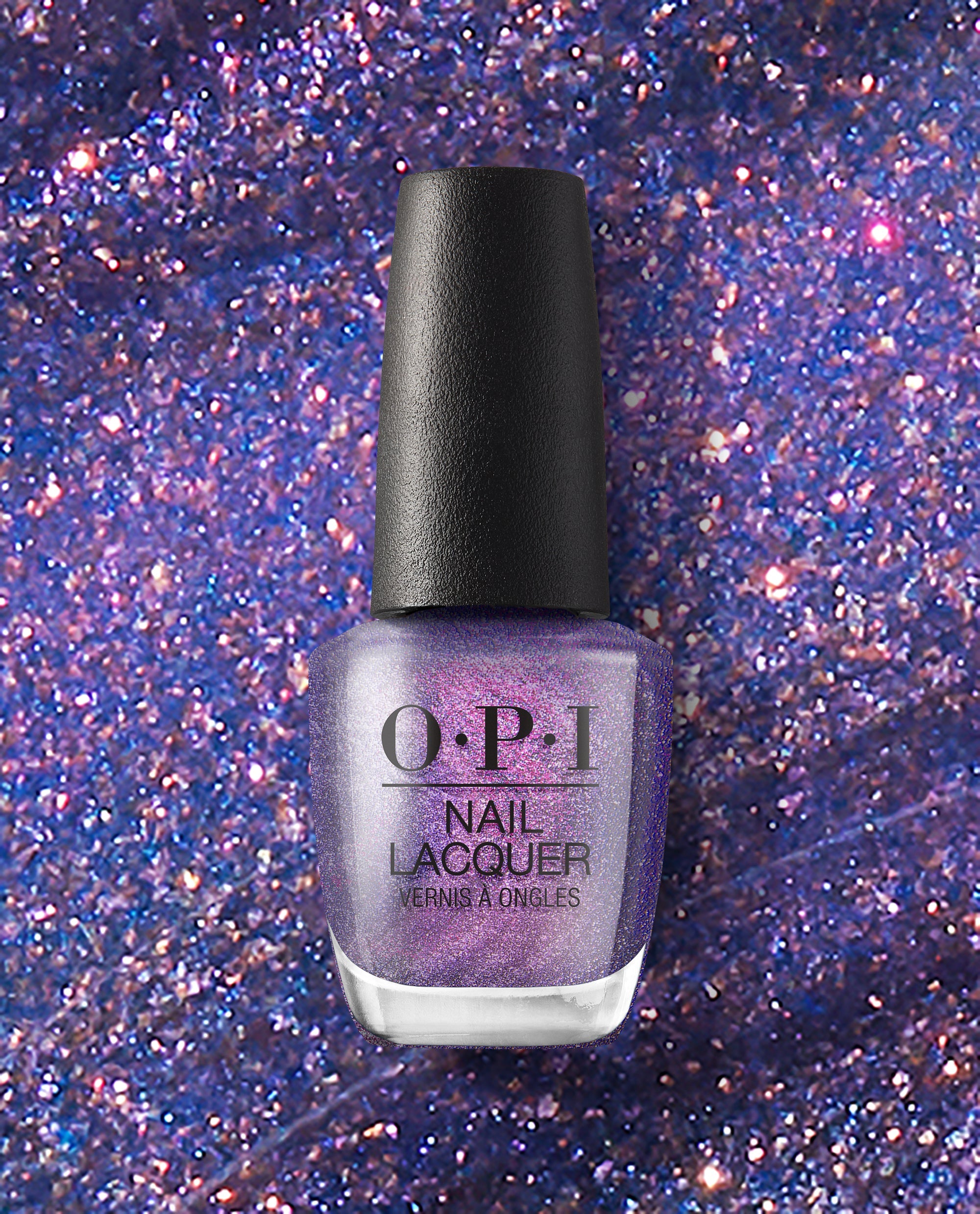 OPI nail polish bottle of Leonardo's Model Color nail lacquer standing upright, showcasing a shimmery purple metallic shade against a sparkling, glittery violet background.