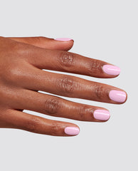 Hand displays glossy pastel lavender manicure with Let Me Lavender at-home gel nail polish by OPI, a soft shade for fall nail colors, on a light gray background.