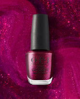 OPI Lincoln Park After Brunch nail lacquer bottle with a black cap and deep magenta shimmer polish, centered against a sparkling pink glitter background.