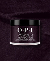 OPI Powder Perfection Lincoln Park at Midnight dipping powder jar showcases a deep eggplant purple shimmer shade against a matching textured powder background, ideal for dramatic fall nail colors.