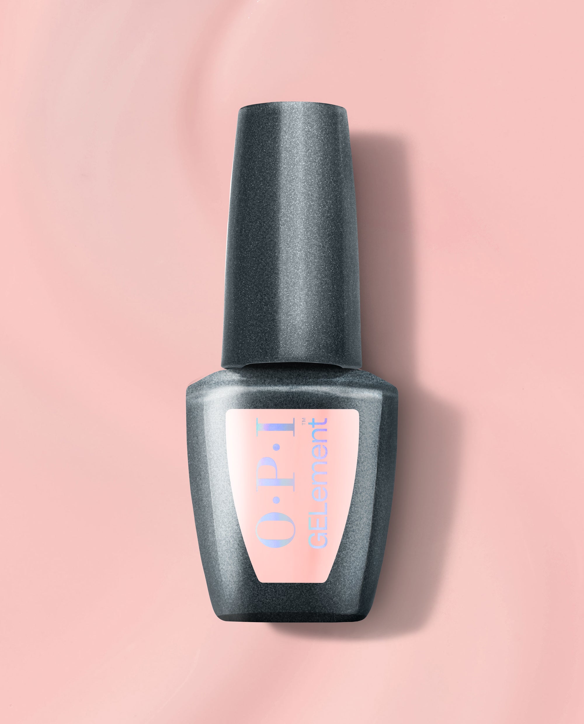 OPI Made Ya Blush at-home gel nail polish bottle with a dark gray cap and soft pink label, centered on a blush pink background for a trending manicure shade.