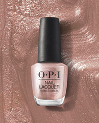 OPI nail polish Metallic Composition nail lacquer bottle standing upright, showing a shimmery rose-gold metallic shade against a matching sparkling polish smear background for a glam manicure look.
