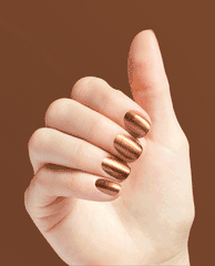 Hand showing OPI Millennium Mocha nail lacquer, a metallic copper-brown manicure with glossy shimmer, posed against a warm mocha background for fall nail colors inspiration.