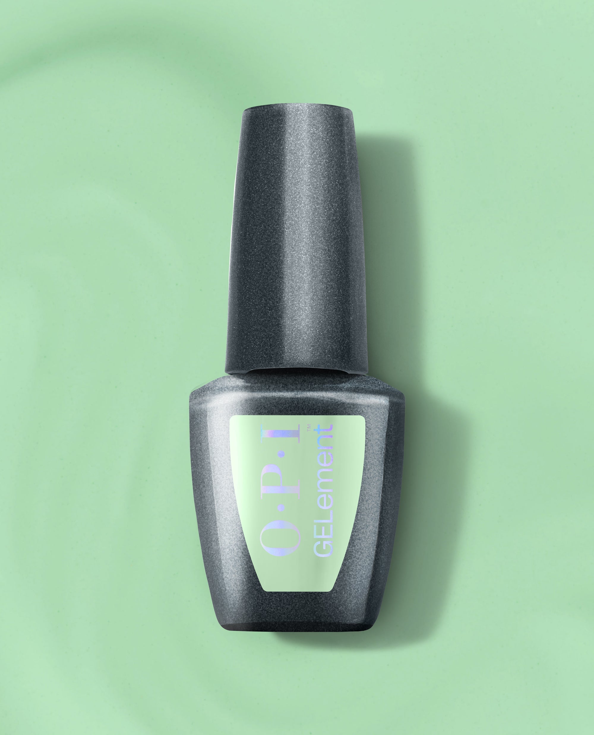 OPI Mint to Be at-home gel nail polish bottle stands upright with a charcoal cap and mint green label on a matching pastel green background.