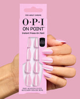 Hand displays OPI On Point Mod About Chrome instant press-on mani in pearly pink chrome, holding the matching 30-nail box against a pink background for fall nail colors.