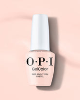 OPI GelColor Mod About You Pastel gel nail polish bottle in soft pale pink stands upright on a blush pink background, a delicate option for fall nail colors.