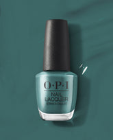 OPI nail polish bottle of My Studio's on Spring teal nail lacquer standing upright against a matching glossy teal background, showcasing the rich, creamy color and black textured cap for a modern salon-quality manicure look.