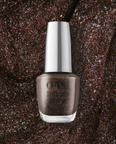 OPI Infinite Shine My Private Jet nail polish bottle in shimmering brown holographic lacquer stands against a matching glitter textured background, highlighting a trending long-lasting manicure shade.