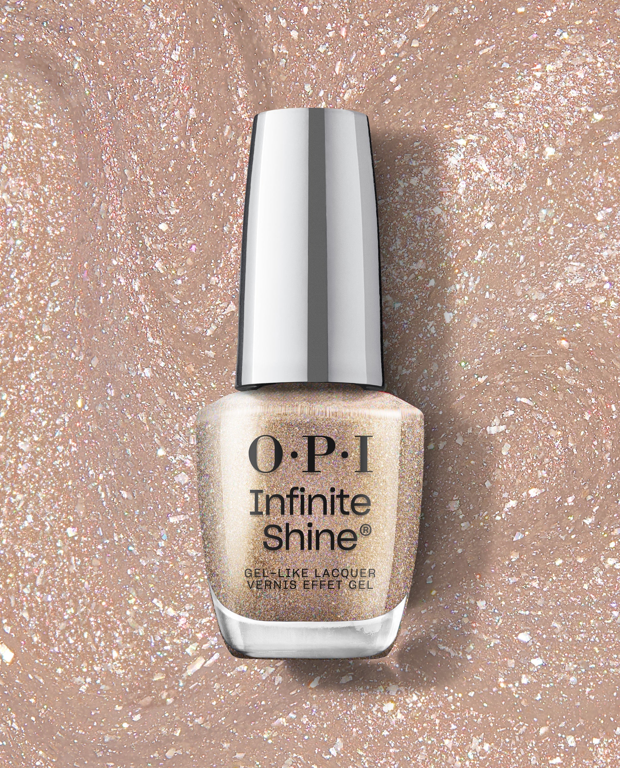 OPI Infinite Shine My Private Yacht gel-like lacquer bottle in champagne-gold holographic glitter, displayed on a sparkling textured swatch for shimmery fall nail colors.