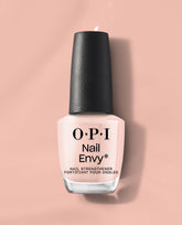 OPI Nail Envy Bubble Bath Nail Strengthener bottle standing upright, showing soft pink treatment polish with black cap and bold logo text against a matching nude-pink background, ideal as a nail polish gift set treatment for stronger nails.
