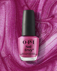 OPI Nail Envy Powerful Pink Nail Strengthener bottle with black cap stands against a shimmering pink polish swirl background, highlighting a trending nail treatment shade.