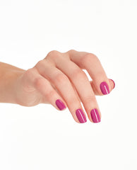 Glossy fuchsia-pink nails showcase OPI No Turning Back From Pink Street Nail Lacquer, a vibrant pick for spring nail colors and spring nail trends, shown on a neatly manicured hand against a clean white studio background.