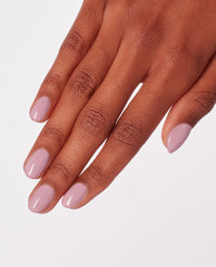 Hand with neatly manicured nails showcases (P)Ink on Canvas, a soft pastel pink OPI nail polish nail lacquer, shining smoothly against a clean white background for a chic, minimalist manicure look.