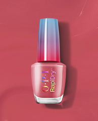 OPI Dry and Dash RapiDry nail polish bottle standing upright, showing a rosy pink shade with a rainbow OPI RapiDry logo and a blue-to-pink ombré cap, centered on a matching pink background for a modern nail polish gift set presentation.
