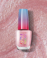 OPI Flash n’ Flirty RapiDry nail polish gift set bottle standing upright, featuring iridescent logo and pink shimmer formula, with a blue-to-pink ombré cap against a sparkling rose-pink glitter background.