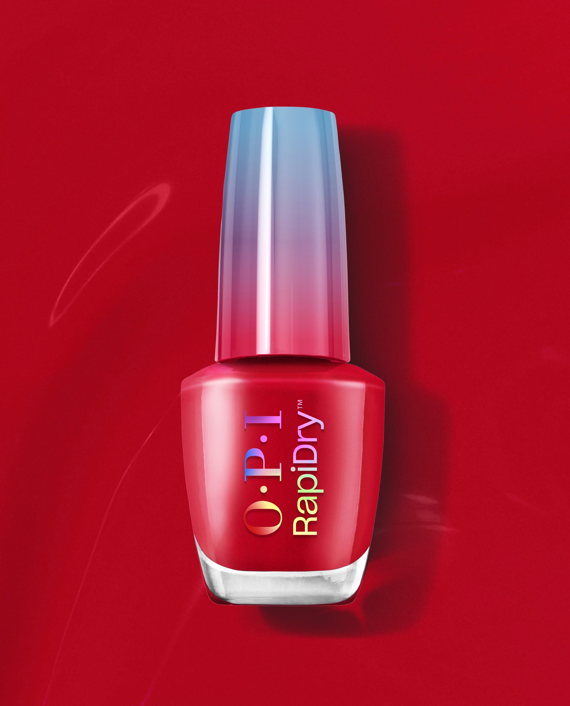 OPI RapiDry nail polish in Secs Appeal, a glossy red fall nail color, standing upright with an iridescent cap on a rich red background.