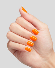 Hand shows short, neatly manicured nails painted in bright orange Rollerbabe Infinite Shine OPI nail polish, highlighting the glossy full-coverage finish against a clean light gray background.
