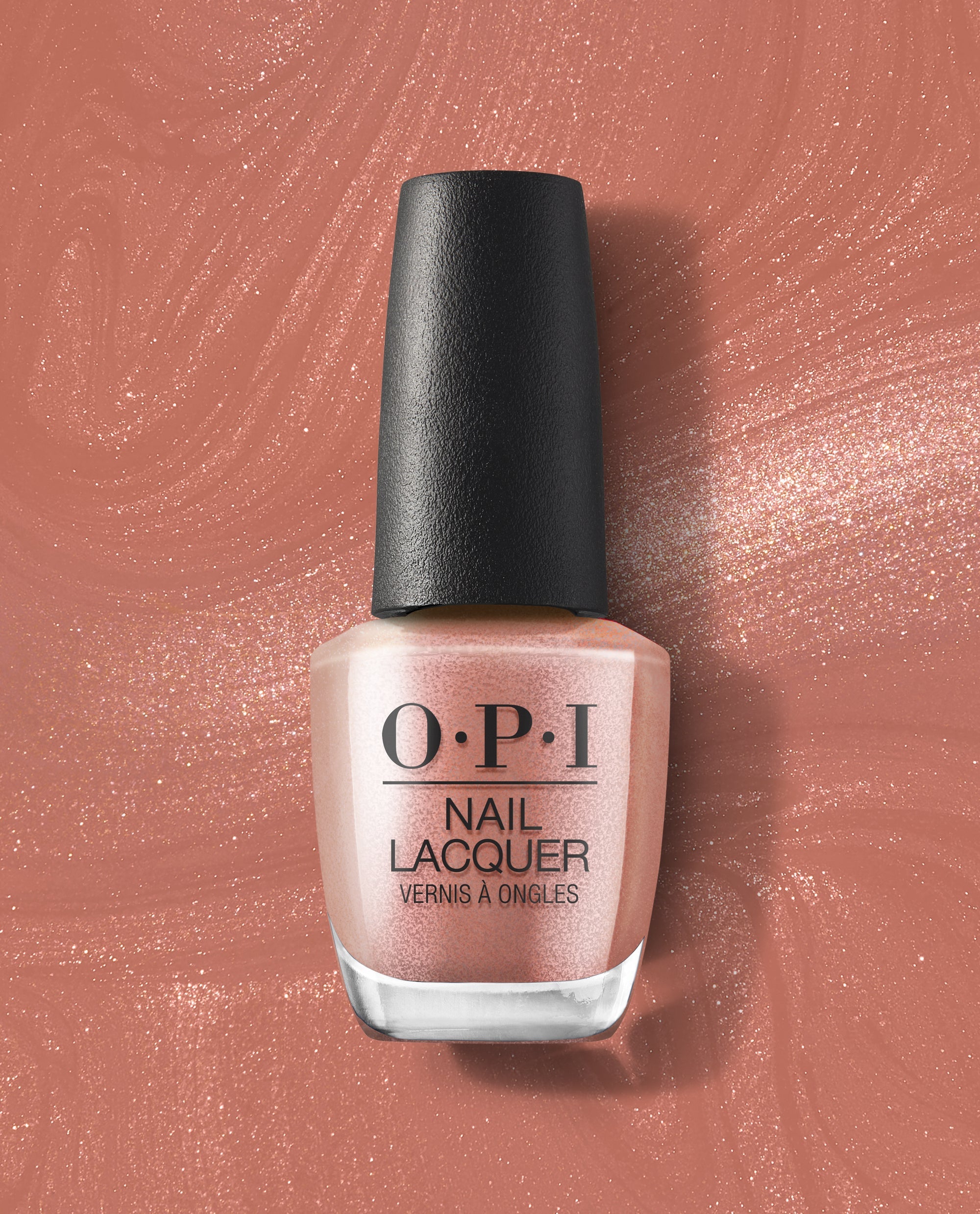 OPI Route Beer Float nail lacquer bottle in a rosy bronze shimmer shade stands on a matching swirled polish background, highlighting warm fall nail colors.