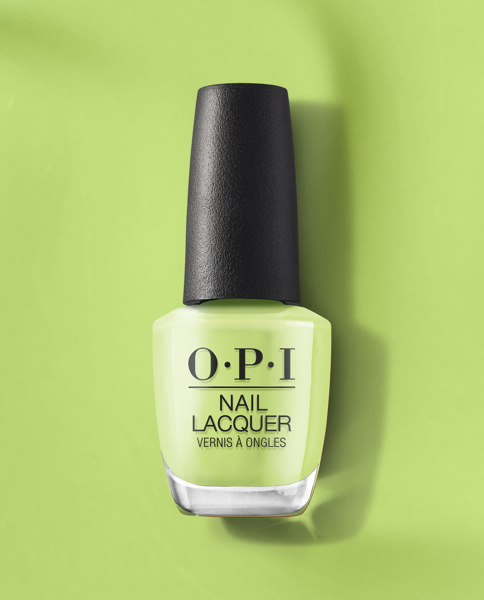 OPI Summer Monday-Fridays Nail Lacquer bottle showcasing bright green nail polish, standing upright on a matching green backdrop, a fresh pick for spring nail colors from OPI with a glossy, creamy finish.