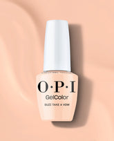 OPI GelColor Suzi Take a Vow gel nail polish bottle in a soft peachy nude shade with a white cap, standing on a peach background for elegant fall nail colors.