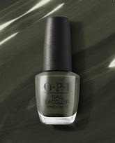 Things I’ve Seen in Aber-green OPI nail polish bottle standing upright, showcasing deep moss-green nail lacquer in a clear glass bottle with black cap against a glossy matching green background.