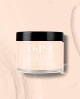 OPI Powder Perfection Throw Me a Wink dipping powder jar in a soft pale peach shade with a black lid, displayed on a matching textured background for fall nail colors.