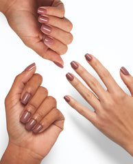 Three hands display glossy mauve nails painted with OPI Tickle My France-y, showcasing the On Point nude shade on different skin tones against a clean white background, ideal for promoting an OPI nail polish gift set.