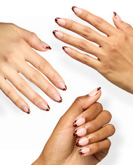 Hands show OPI Tortie Tips Sticking Point nails with glossy nude bases and tortoiseshell French tips, a chic look for fall nail colors on a clean white background.