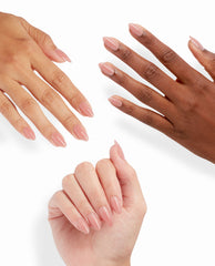 Three hands showcase Totally Pressed xPRESS/ON Iconic Shades (Long), featuring glossy almond-shaped nude press-on nails fanned against a clean white background, highlighting this OPI nail polish gift set alternative for salon-quality manicures at home.